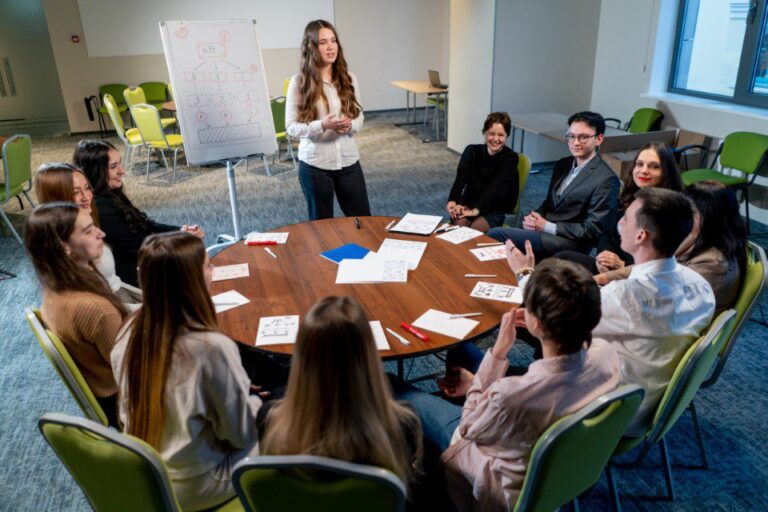 business conference or meeting at the hotel the girl on the flipchart shows the development plan for the company